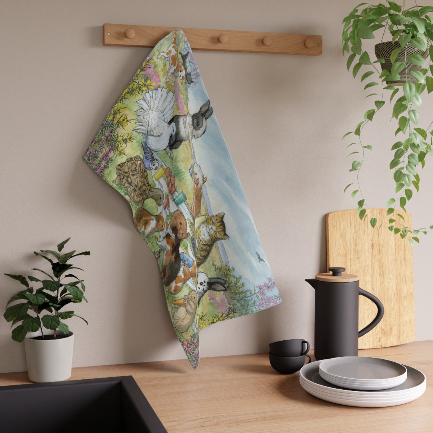 a spiral bound notebook featuring a vintage illustration of pond with frogs, flowers and fairies by Molly Brett