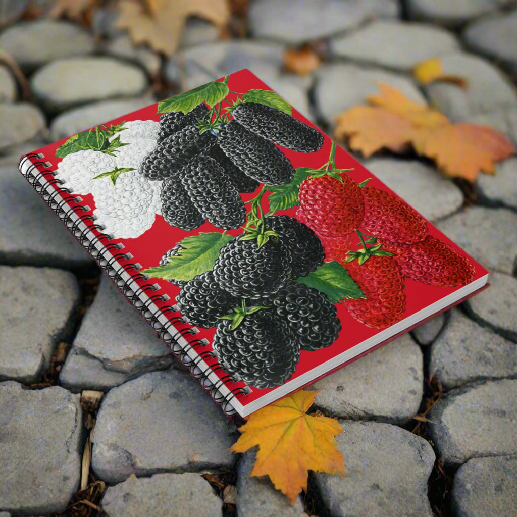 Notebook with blackberries and strawberries design on a red background