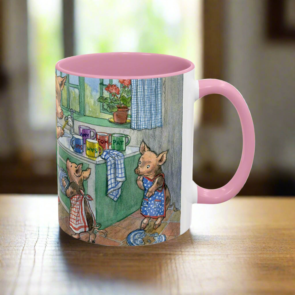 Mug with a colorful illustration of pigs in a kitchen setting and pink handle and interior. from a children's story book