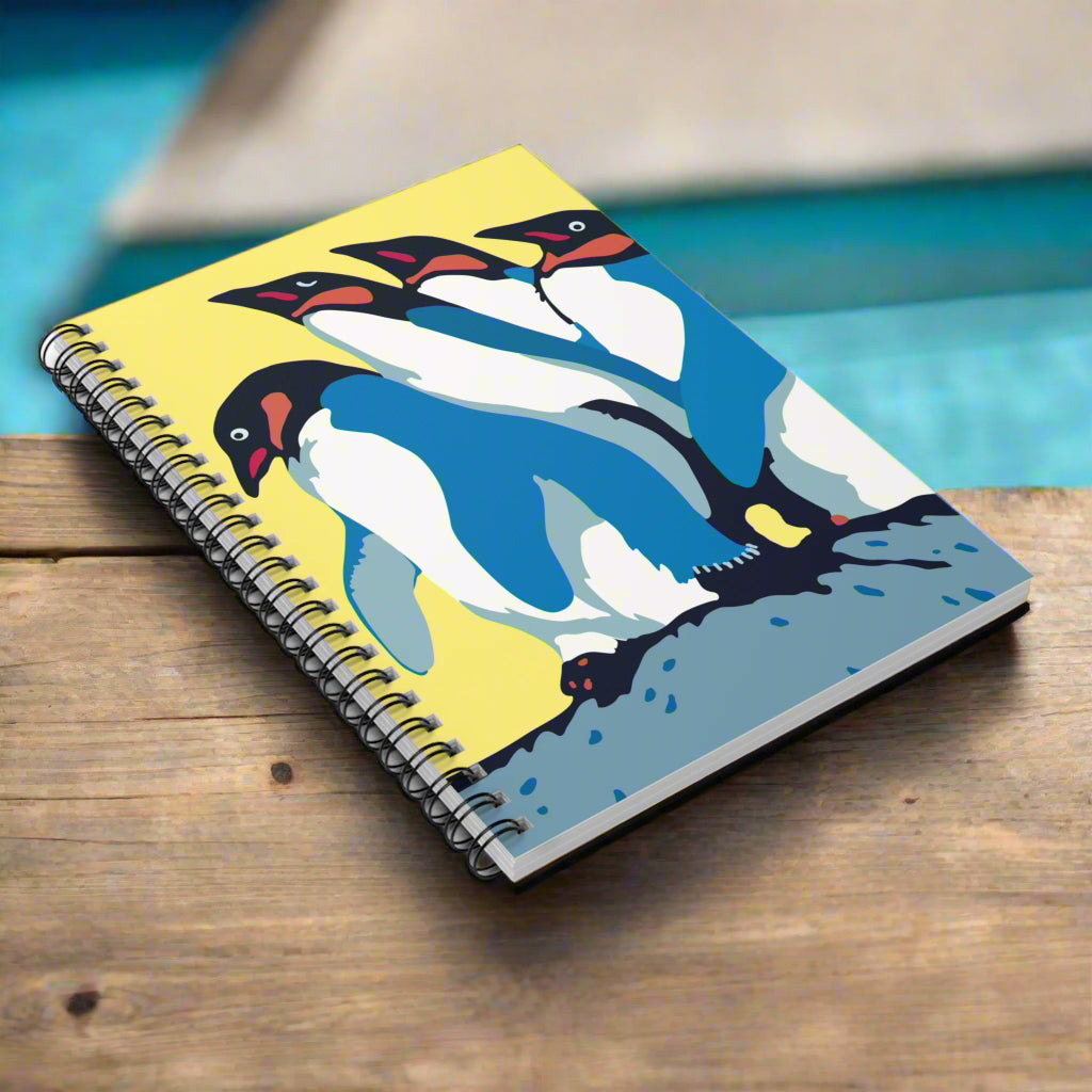 Notebook with penguin design on a white background