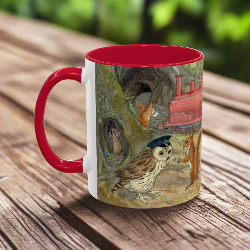 Mug with a colorful design of woodland animals boarding a steam train with a red interior and handle