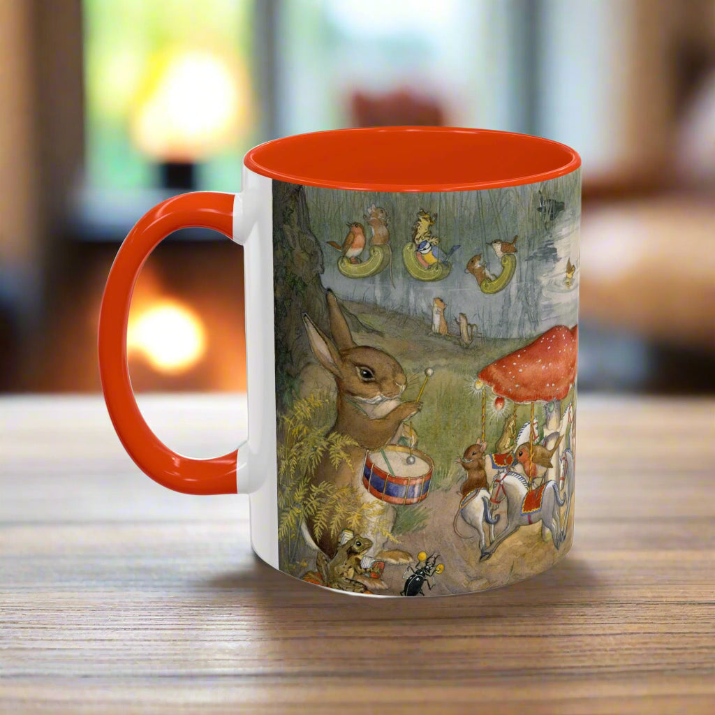 Mug with a colorful design of animals and a red interior