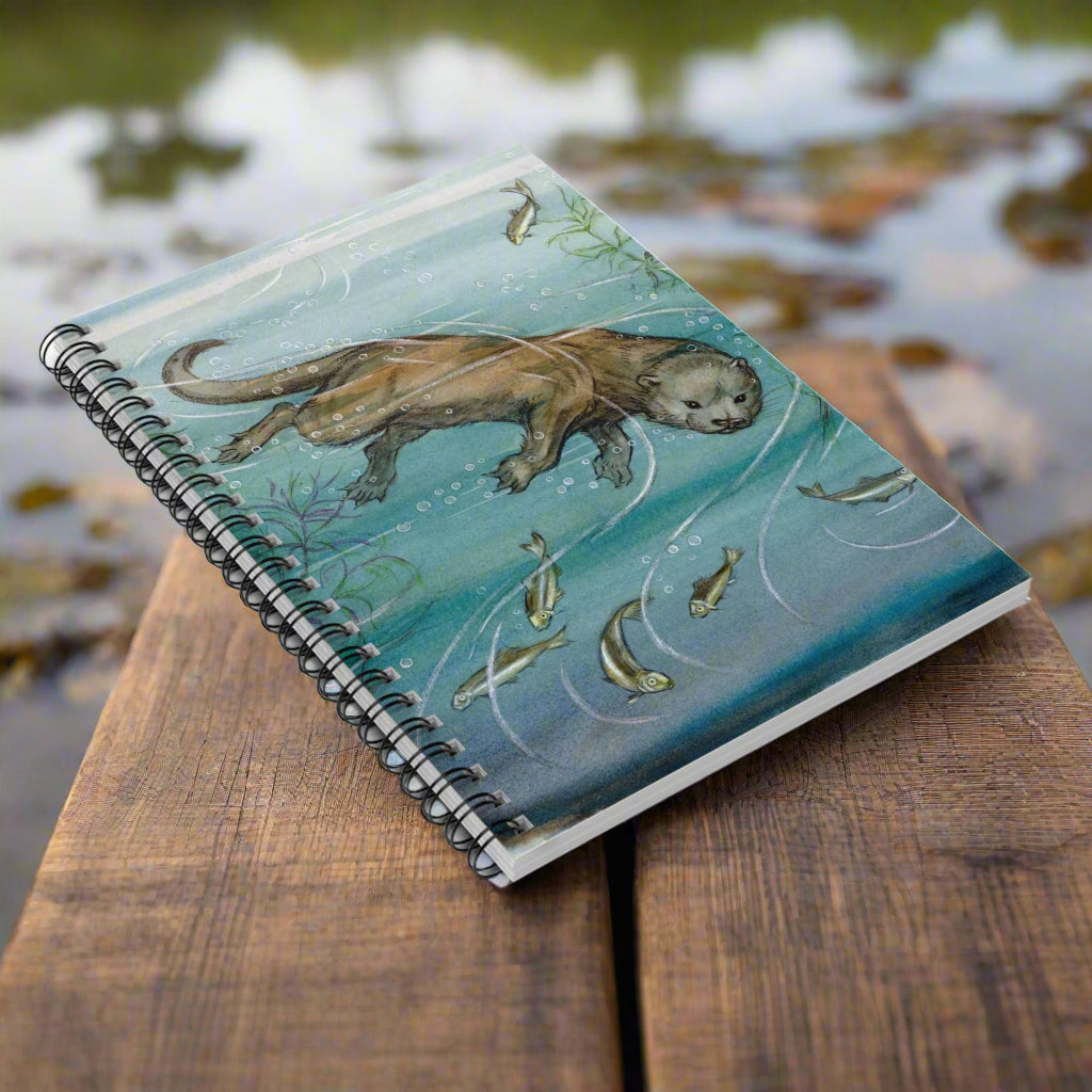 Notebook with an otter illustration on a white background