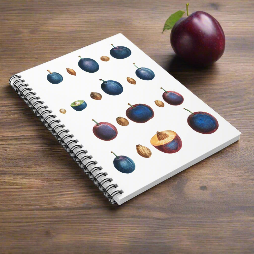 Notebook with plum illustrations on a white background