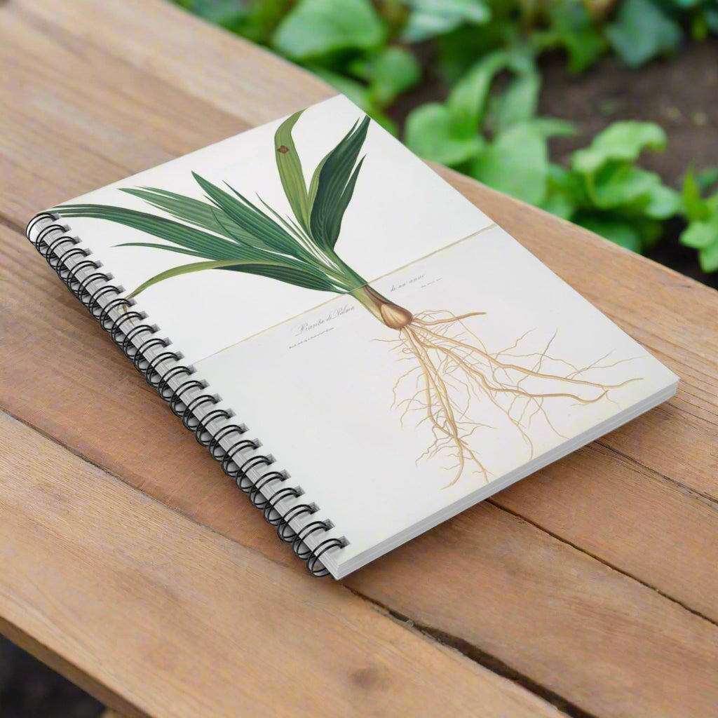 Notebook with a plant design on the cover on a white background