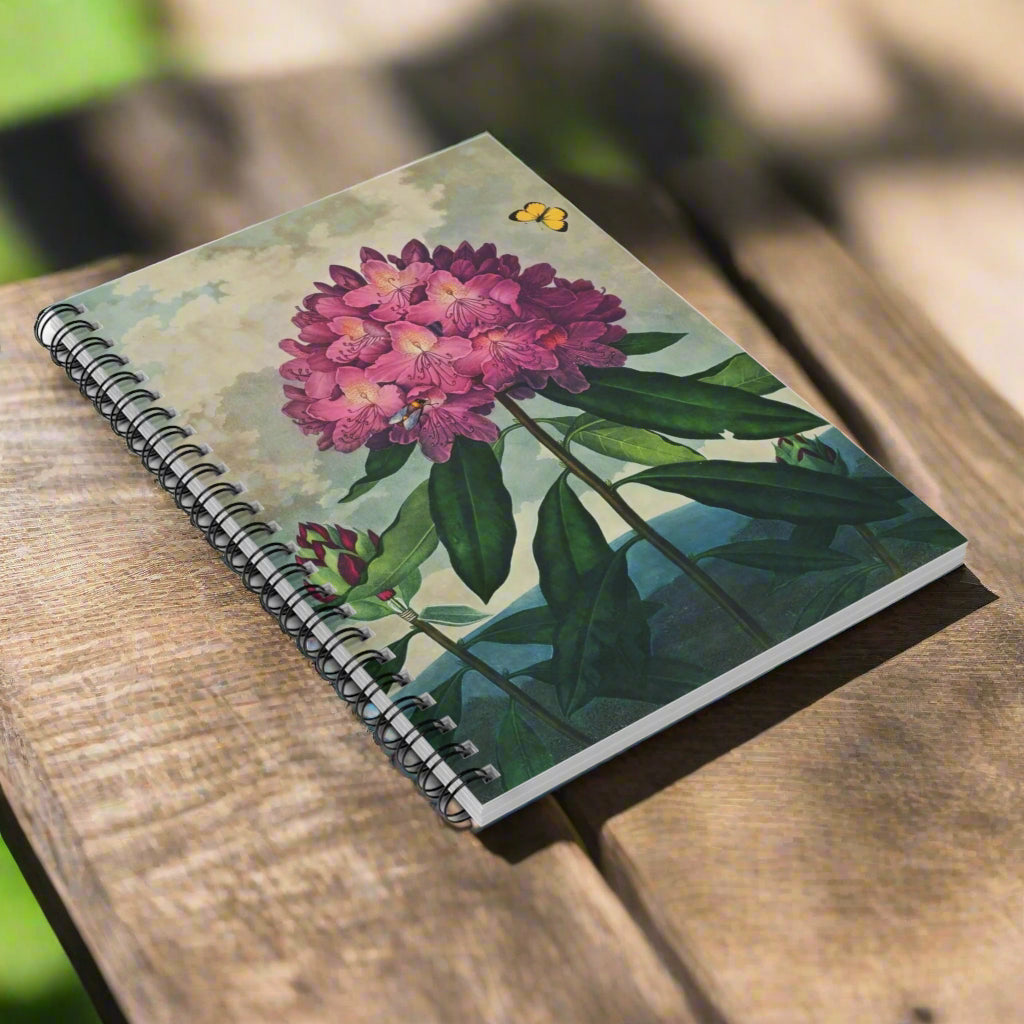 Notebook with floral design on a white background